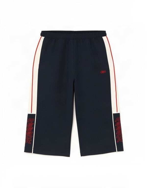 Pantaloni Reebok Graphic Windbreaker pentru băieți 15-16 ani XL bleumarin