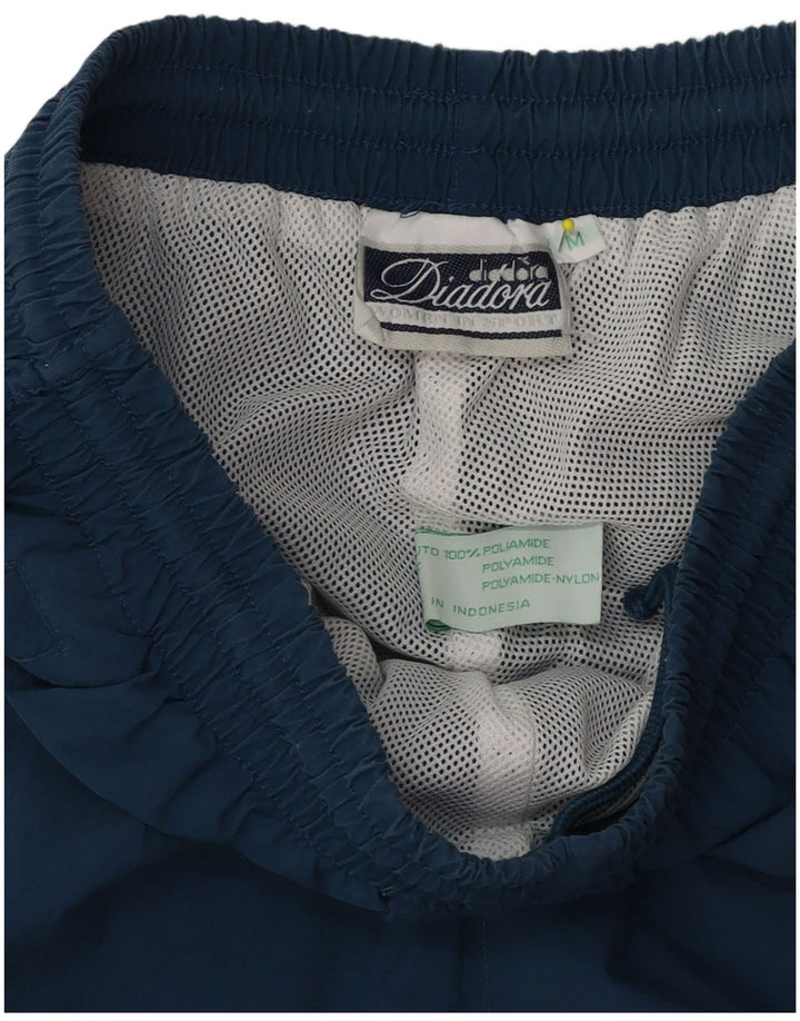 Pantaloni de trening Diadora pentru bărbați, poliester albastru mediu