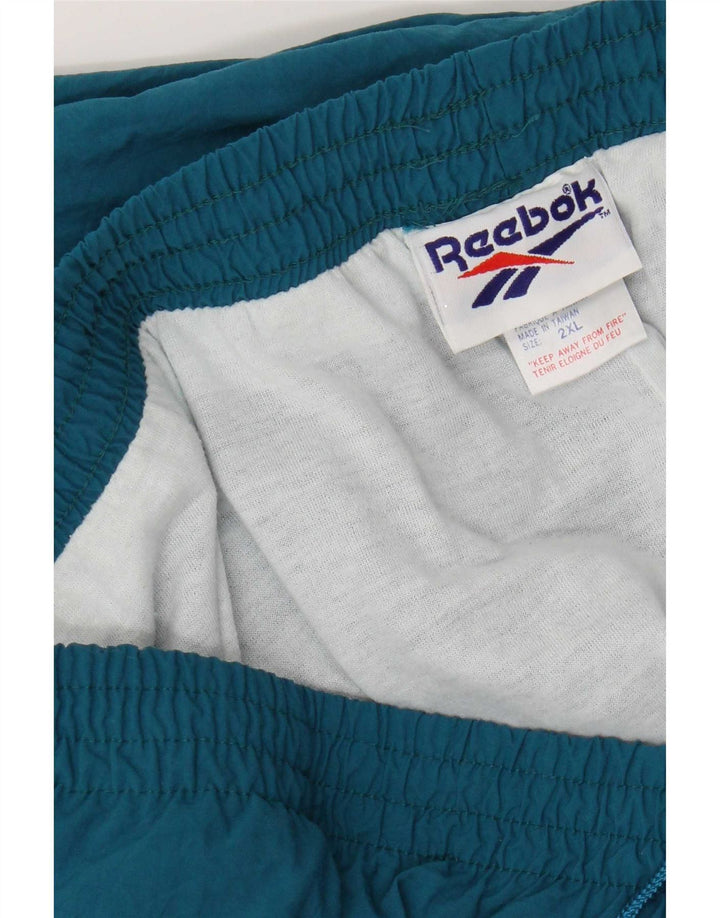 Pantaloni de trening pentru bărbați Reebok Pantaloni de jogging 2XL Blue Nylon