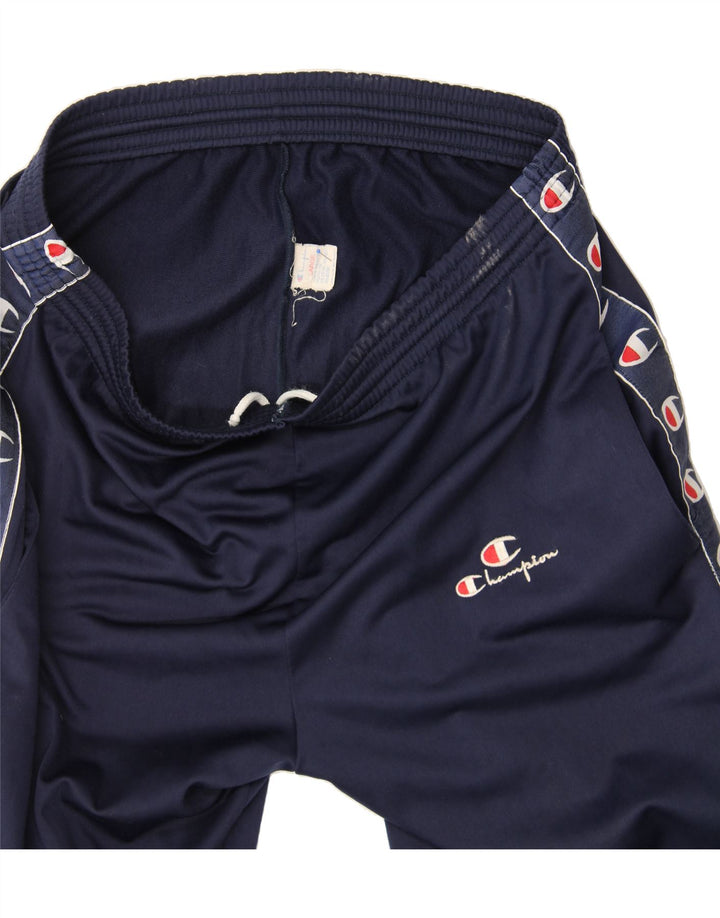 CHAMPION Mens Graphic Tracksuit Trousers Large  Navy Blue Polyester Vintage Champion and Second-Hand Champion from Messina Hembry 