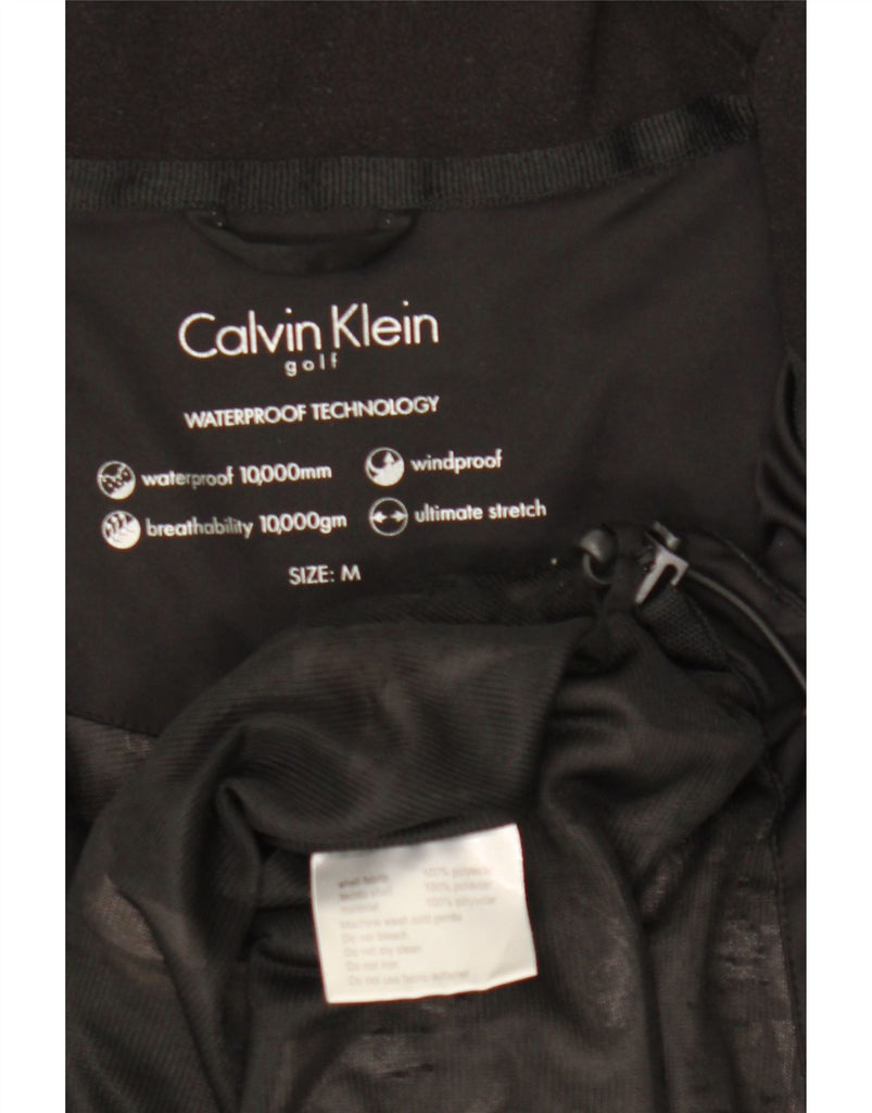CALVIN KLEIN Mens Golf Rain Jacket Medium Black Polyester Vintage Calvin Klein and Second-Hand Calvin Klein from Messina Hembry 
