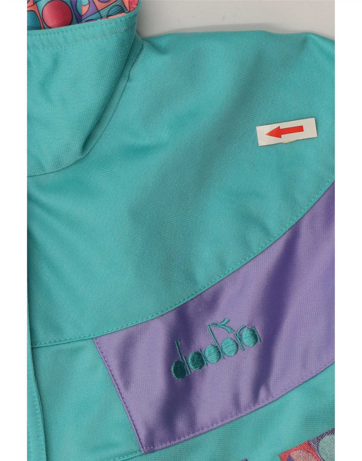 Jachetă de trening Diadora pentru femei IT 46 Large Turcoaz Colorblock