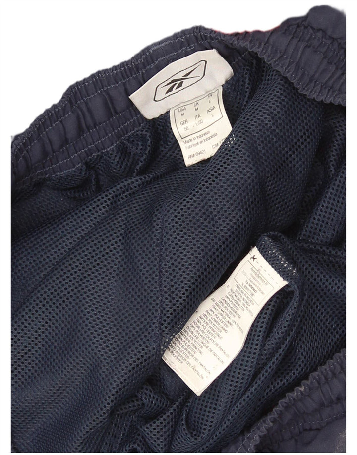 Pantaloni de trening grafic pentru bărbați Reebok Pantaloni de jogging, medii, bleumarin, color block