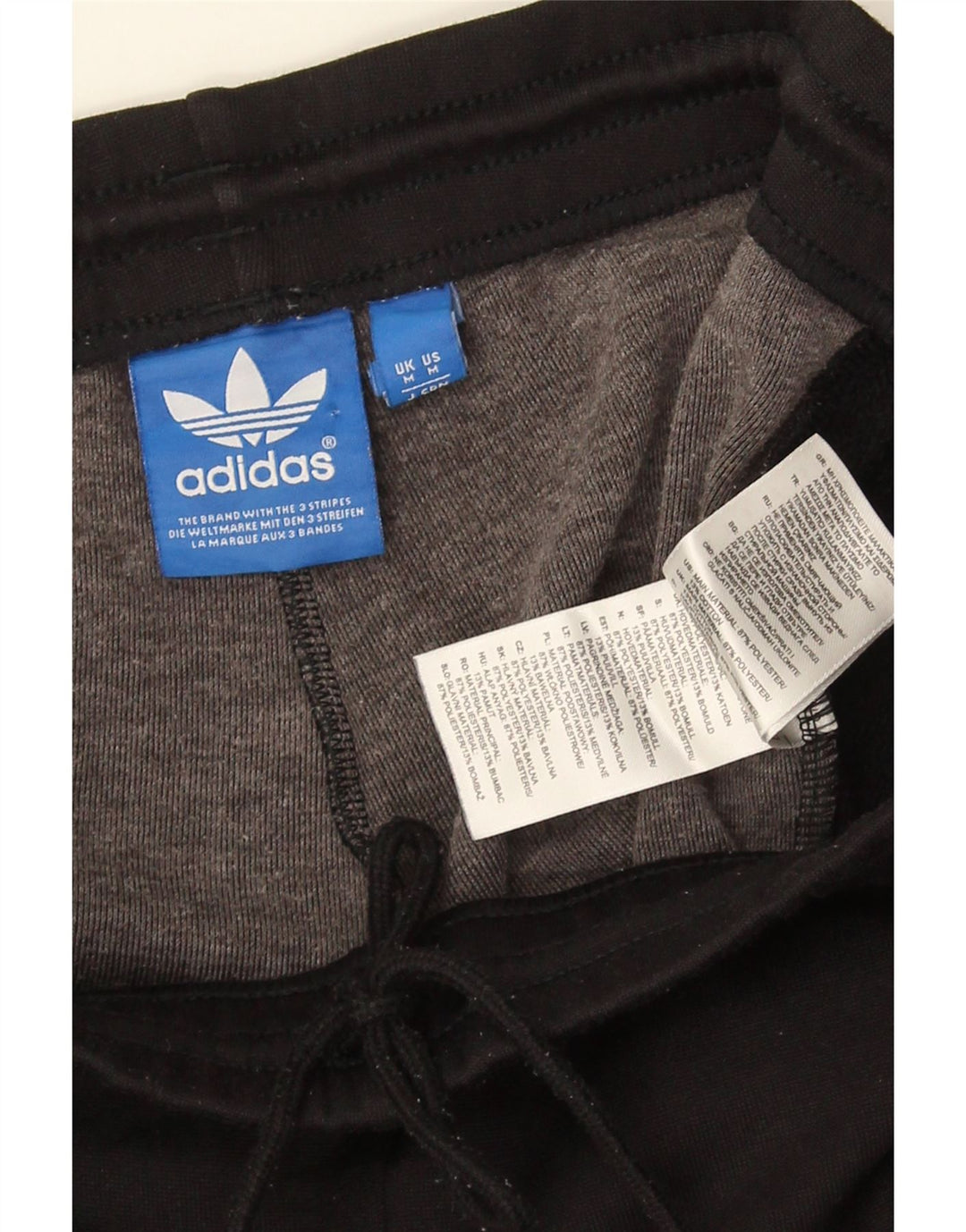 Pantaloni de trening grafic pentru bărbați Adidas, negru mediu, poliester bloc de culoare