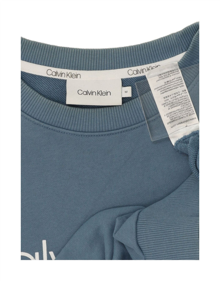 CALVIN KLEIN Mens Graphic Sweatshirt Jumper Medium Blue Cotton Vintage Calvin Klein and Second-Hand Calvin Klein from Messina Hembry 