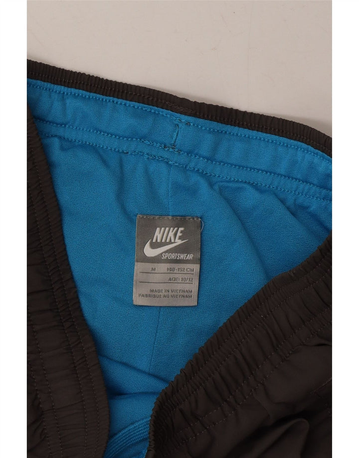 NIKE Boys Graphic Tracksuit Trousers Joggers 10-11 Years Medium  Grey Vintage Nike and Second-Hand Nike from Messina Hembry 