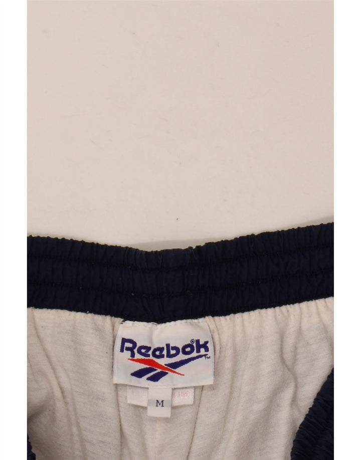 Pantaloni de trening pentru bărbați Reebok Pantaloni de jogging, nailon mediu bleumarin