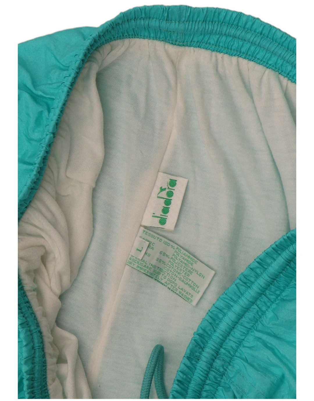 Pantaloni de trening Diadora pentru bărbați, largi, turcoaz, poliamidă color bloc