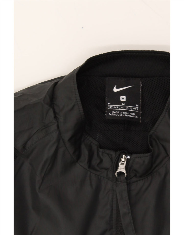 NIKE Boys Tracksuit Top Jacket 10-11 Years Medium Black Polyester Vintage Nike and Second-Hand Nike from Messina Hembry 