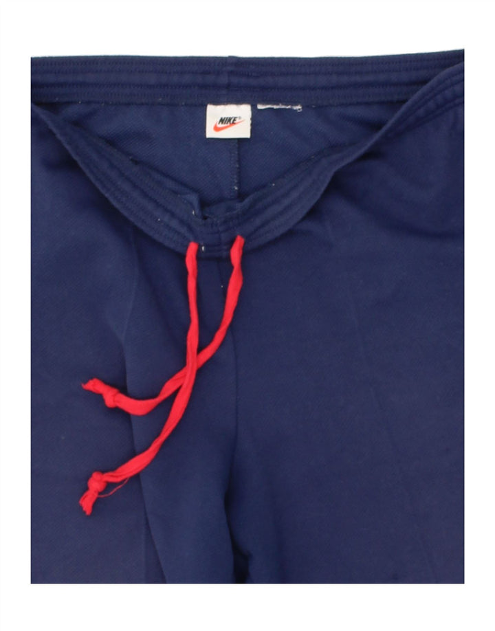NIKE Womens Tracksuit Trousers UK 14 Large Navy Blue Polyester Vintage Nike and Second-Hand Nike from Messina Hembry 