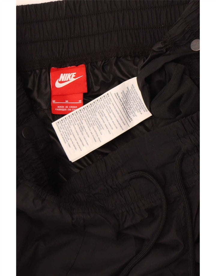 Pantaloni de jogging pentru femei Nike impermeabili UK 12 Poliester mediu negru